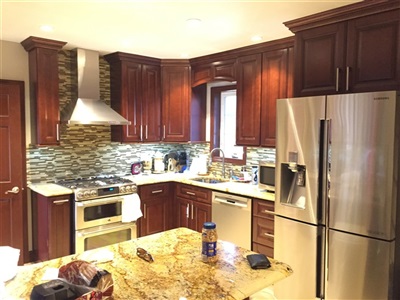 Kitchen in Hollis 
TSG Pacifica cabinet with solarius granite